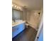 Bright bathroom features a double vanity, quartz countertops, and a shower-tub combination at 5578 Metrowest Blvd # 305, Orlando, FL 32811