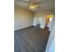 Bedroom boasts modern flooring, ceiling fan, closet, and ensuite bathroom at 5578 Metrowest Blvd # 305, Orlando, FL 32811