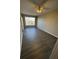 Bedroom features modern flooring, large window, and ceiling fan at 5578 Metrowest Blvd # 305, Orlando, FL 32811