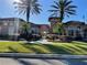 Beautiful community clubhouse featuring meticulously maintained landscaping and Mediterranean-style architecture at 5578 Metrowest Blvd # 305, Orlando, FL 32811