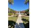 Beautiful community with a lush green courtyard, fountain, and mediterranean-style pavilions at 5578 Metrowest Blvd # 305, Orlando, FL 32811
