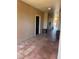Hallway with tiled floor and door leading into unit at 5578 Metrowest Blvd # 305, Orlando, FL 32811