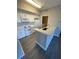 Updated kitchen with stainless appliances and quartz countertops at 5578 Metrowest Blvd # 305, Orlando, FL 32811