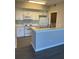 Bright kitchen featuring modern appliances and plenty of counter space at 5578 Metrowest Blvd # 305, Orlando, FL 32811