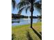 Scenic view of the community pond, featuring a fountain and lush landscaping at 5578 Metrowest Blvd # 305, Orlando, FL 32811