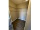 Spacious walk-in closet features modern flooring and multiple wire shelves at 5578 Metrowest Blvd # 305, Orlando, FL 32811