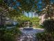 Beautiful courtyard featuring a fountain, mature landscaping, and a view of the adjacent high rise at 620 E Church St, Orlando, FL 32801