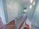 Upstairs hallway with wooden floors, and stylish modern railing at 620 E Church St, Orlando, FL 32801