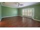 Spacious living room featuring hardwood floors, large bay window and neutral-colored walls at 620 E Church St, Orlando, FL 32801