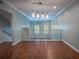 Loft with wood floors, recessed lighting, and a modern railing overlooking the living room at 620 E Church St, Orlando, FL 32801