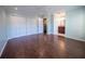 Large primary bedroom with hardwood floors, a ceiling fan, and an attached bathroom at 620 E Church St, Orlando, FL 32801