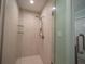 Modern bathroom featuring a frameless glass enclosed shower and tiled walls at 620 E Church St, Orlando, FL 32801