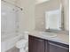 The bathroom features a single sink vanity with a shower and bathtub combination at 6613 Duncaster St, Windermere, FL 34786