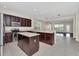 Well-appointed kitchen with stainless steel appliances and dark wood cabinets at 6613 Duncaster St, Windermere, FL 34786
