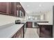 Sleek kitchen with stainless steel appliances, granite countertops, and an island with seating at 6613 Duncaster St, Windermere, FL 34786