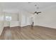 Open living room space with hardwood floors, neutral paint, and plenty of natural light at 6613 Duncaster St, Windermere, FL 34786