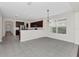 This open-concept features a seamless transition from living to kitchen with tile floors at 6613 Duncaster St, Windermere, FL 34786