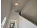 High-ceilinged foyer with bright white walls, trim accents and an upper level staircase at 7020 Rolling Leaf Dr, Groveland, FL 34736
