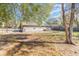 Back yard view of the residence with mature trees at 7906 Rideout Rd, Riverview, FL at 7906 Arabian Pl, Orlando, FL 32818
