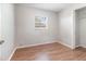 Bedroom with hardwood floors, window, and closet for a tenant at 7906 Rideout Rd, Riverview, FL at 7906 Arabian Pl, Orlando, FL 32818