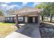 House exterior with carport and grey colored brick at 7906 Rideout Rd, Riverview, FL at 7906 Arabian Pl, Orlando, FL 32818