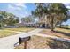 House exterior with mature trees and a front lawn at 7906 Rideout Rd, Riverview, FL at 7906 Arabian Pl, Orlando, FL 32818