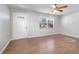 Bright living room featuring wood-look flooring and natural light at 7906 Arabian Pl, Orlando, FL 32818