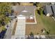 Aerial view of single Gathering home featuring a spacious driveway, landscaping and a fenced backyard at 823 Kokomo Cir, Port Orange, FL 32127