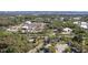 Aerial view showcasing the home's proximity to nearby businesses and the city at 823 Kokomo Cir, Port Orange, FL 32127