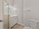 Modern bathroom features white cabinets, quartz countertop, and walk in shower at 823 Kokomo Cir, Port Orange, FL 32127