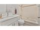 Bathroom with modern vanity, tub/shower combo, and neutral color scheme at 823 Kokomo Cir, Port Orange, FL 32127