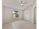 Empty bedroom features neutral tones, window view and closet with ample space at 823 Kokomo Cir, Port Orange, FL 32127