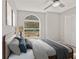 Bright bedroom features neutral tones, window view and closet with ample space at 823 Kokomo Cir, Port Orange, FL 32127