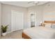 Bright bedroom features neutral tones, closet, and doorway leading to an ensuite bathroom at 823 Kokomo Cir, Port Orange, FL 32127