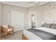 Bright bedroom features neutral tones, closet, and doorway leading to an ensuite bathroom at 823 Kokomo Cir, Port Orange, FL 32127