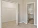 Bedroom closet view shows ample storage and doorway leading to an ensuite bathroom at 823 Kokomo Cir, Port Orange, FL 32127