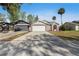 Charming single Gathering home featuring a two-car garage and well-maintained landscaping at 823 Kokomo Cir, Port Orange, FL 32127