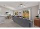 Bright living room featuring tile floors, a ceiling fan, and sliding glass doors to the backyard at 823 Kokomo Cir, Port Orange, FL 32127