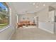 Inviting living room with tile flooring, a ceiling fan, and abundant natural light at 823 Kokomo Cir, Port Orange, FL 32127