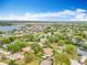 Aerial view displays community near the lake, with lush greenery and beautiful skyline at 11512 Grand Bay Blvd, Clermont, FL 34711
