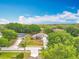 A lovely neighborhood from above shows manicured yards, mature trees, and well-spaced homes at 11512 Grand Bay Blvd, Clermont, FL 34711