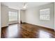 Bright bedroom featuring hardwood floors and two large windows at 11512 Grand Bay Blvd, Clermont, FL 34711