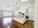 Spacious kitchen features modern stainless steel appliances, marble countertops, and wood floors at 11512 Grand Bay Blvd, Clermont, FL 34711