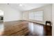 Bright living room with hard floors, fan, and large window at 11512 Grand Bay Blvd, Clermont, FL 34711