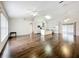 Open-concept living room featuring hardwood floors and a seamless transition to the kitchen at 11512 Grand Bay Blvd, Clermont, FL 34711
