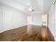 Bright main bedroom with hardwood floors and en-suite bathroom access at 11512 Grand Bay Blvd, Clermont, FL 34711