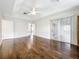 Spacious main bedroom featuring hardwood floors and glass sliding door to the backyard at 11512 Grand Bay Blvd, Clermont, FL 34711