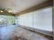 Enclosed sunroom with tile flooring, a ceiling fan, and screened windows for relaxing at 11512 Grand Bay Blvd, Clermont, FL 34711