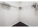 Walk-in closet featuring wire shelving and hardwood floors at 11512 Grand Bay Blvd, Clermont, FL 34711