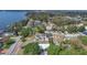 Aerial view showcases the home's proximity to the lake and surrounding nature at 1203 Judy Ave, Tavares, FL 32778